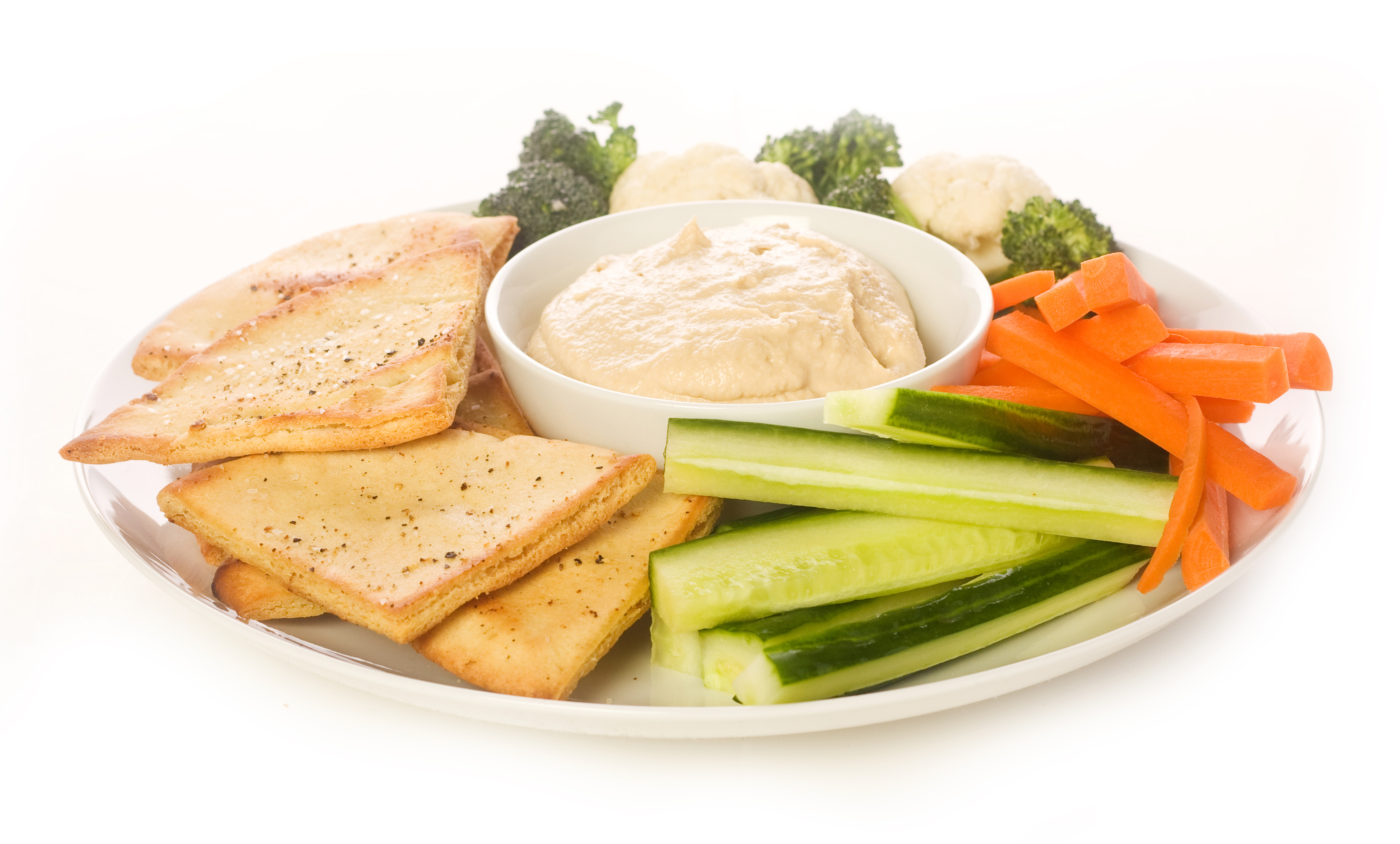 Pita chips and fresh vegetable make a healthy appetizer or snack along with hummus