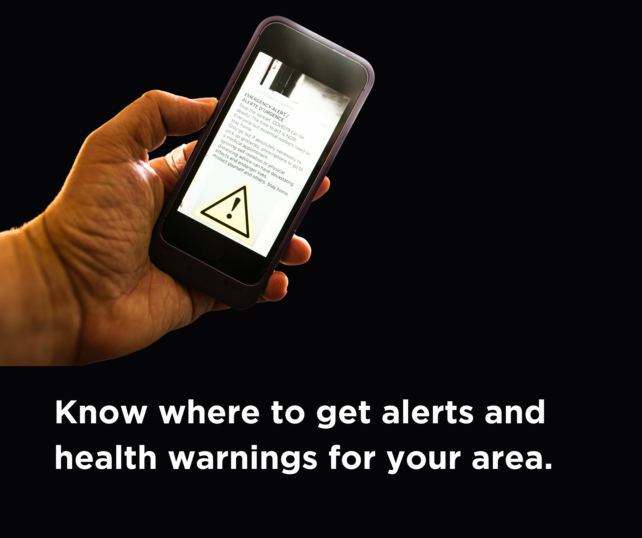 Closeup of hand holding cell phone with alert on screen with caption: "Know where to get alerts and health warnings for your area
