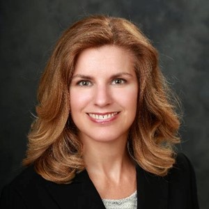 Headshot of board member Nora Lacey