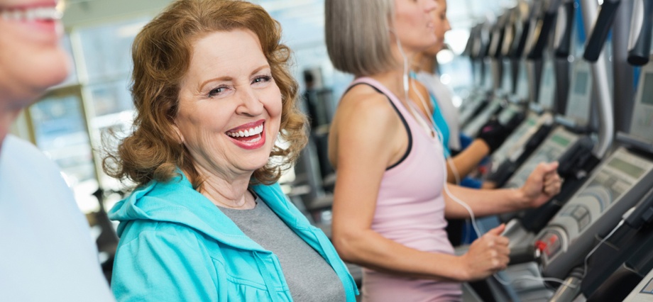 smiling older woman at gym